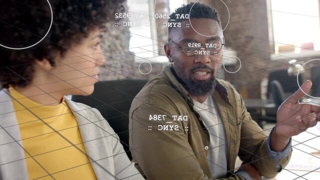 Man on sofa turning explaining tech data clarifying sync, AR grid showing DAT nodes on faces