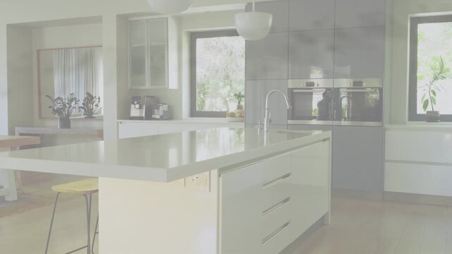 Kitchen island and gloss counter revealing as wide shot triggers camera pan right to show layout