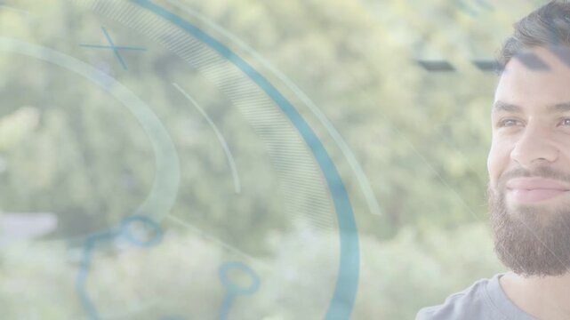 Adult man reacting to expanding blue ringed overlay over foliage, smiling and tilting for tech demo