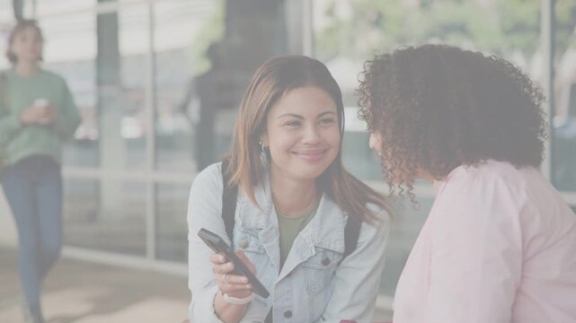 Woman tapping phone and showing transit time to friend, animated ETA overlay hovering over phone