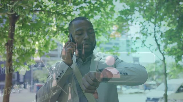 Businessman walking sidewalk speaking on phone checking watch during call causing overlays for info
