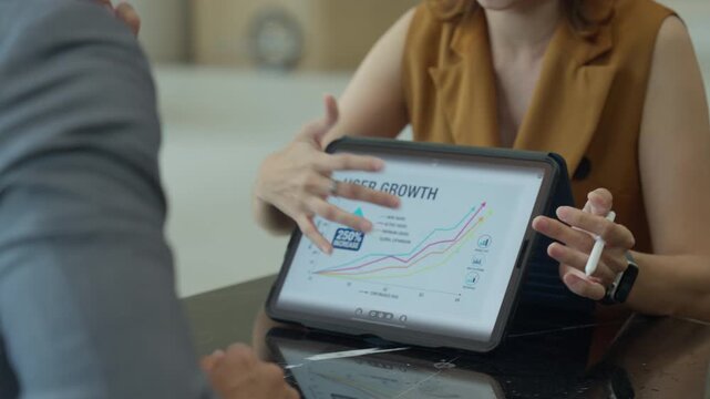 Business model marketing strategy with ai on tablet chart and analysis guide meeting in office, focused teamwork and clear plan drive growth, user analytics and confident communication for leaders