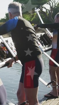 Vertical video: Rowing team carrying shell along dock after lifting hull from water for docking