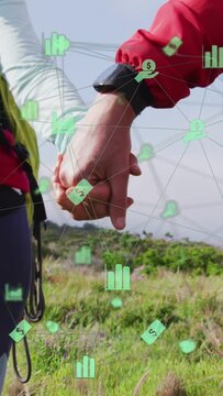 Vertical video: Couple holding hands walking coast wrist turning revealing watch showing finance UI