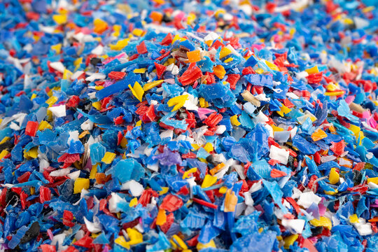 Plastic colorful pieces recycling shredded for industrial use.