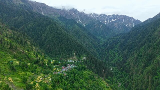 Aerial pullback panorama of Grahan village in Himalayan valley, India