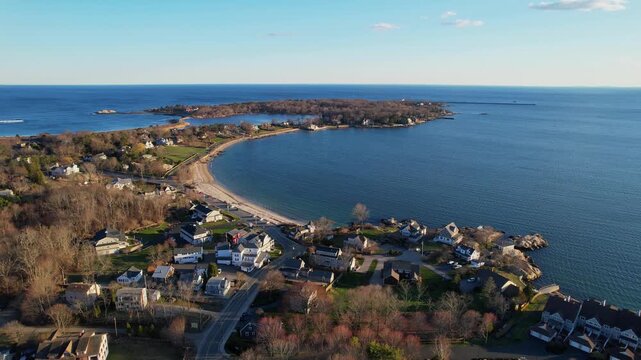 Amazing drone fly toward the Eastern Point of Gloucester coastline neighborhood on shoreline housing environment, Massachusetts, US