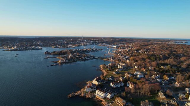 Distant panorama drone view of Inner Harbor bay with populated homes areas, Gloucester, Massachusetts, US