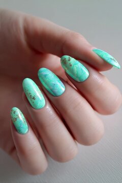 Elegant woman's hand displays trendy marble effect fingernail polish with subtle gold accents, implying smooth motion and beauty care video footage