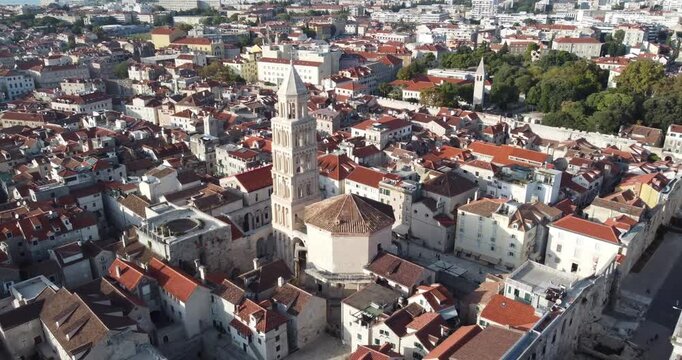 Aerial view of the city of Split, the cathedral and the Roman emperor's palace with people walking through its streets on a sunny summer day full of tranquility, Split, Croatia..mp4