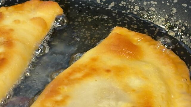 a cheburek with meat and a golden crust