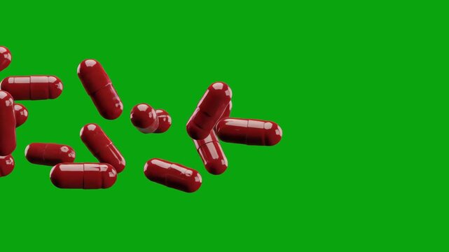 A 3D animation of vibrant red medical capsules falling diagonally. The solid green screen background allows for seamless compositing in pharmacy commercials, healthcare educational materials, and scie