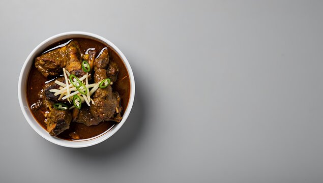 eid al-adha eid ul fetter minimalist beef stew in white bowl with garnish on light background isolated
