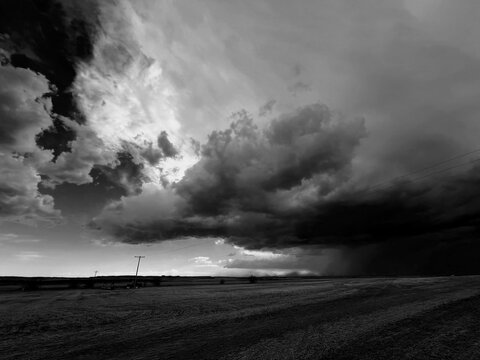 Massive dark clouds descend on a Montana field