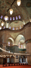Naklejka premium Interior of Blue Mosque Sultan Ahmed with stained glass windows and decorated dome, Istanbul, Turkey