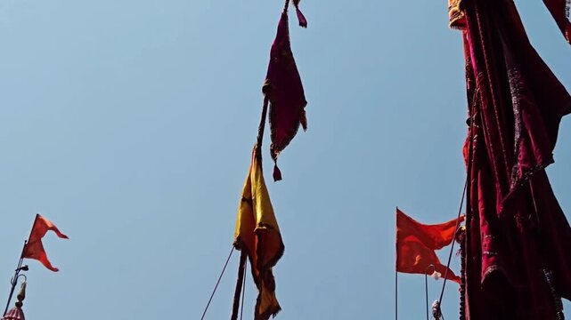 At the Yerad Yatra, towering Sasan Kathi sticks dance high during the Chhabina. These 70-foot poles, adorned with flags, honor Lord Yedoba, the vibrant faith of Maharashtrian devotees. Not similar.