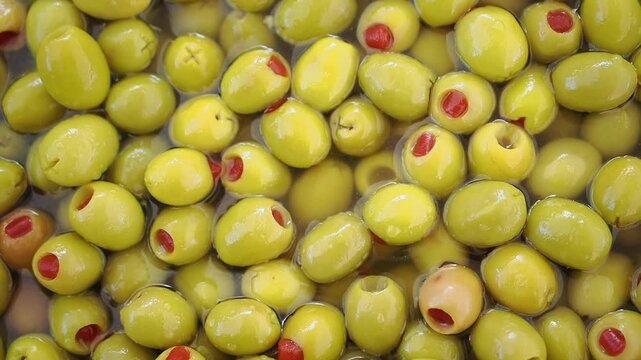 Olives in brine at a local market in the afternoon