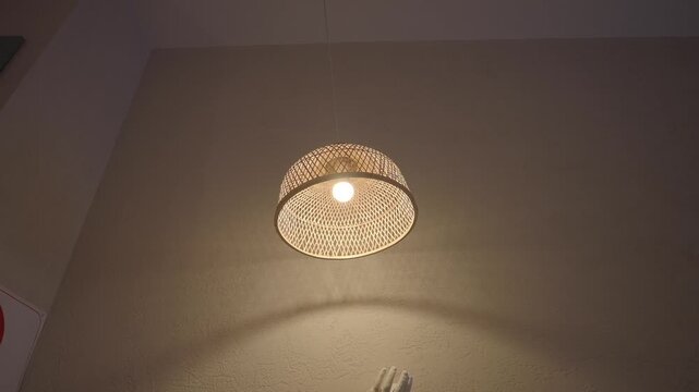 Light fixture hanging on wall in a room