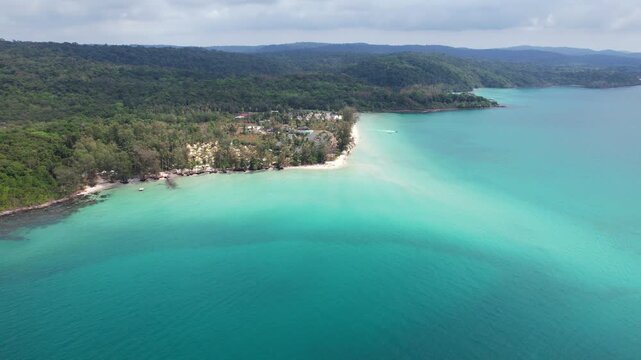 Tropical Coastline At Secret Sunset Beach With Green Forest And White Sand On Koh Kood Island, Thailand. wide aerial shot