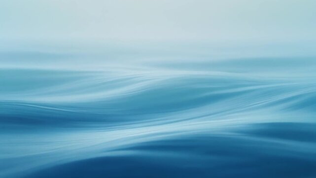 Calm ocean waves, gentle movement, shades of blue, soothing background, minimalism.