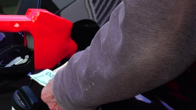 Paying for gas leaves an empty wallet as rising fuel costs strain budgets and highlight financial struggle and inflation