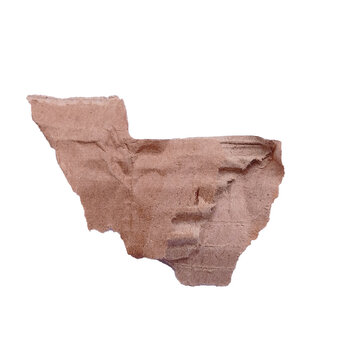 A close-up view of a broken piece of clay revealing faint lines of ancient cuneiform writing.