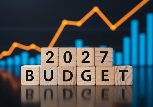 2027 Budget Concept with Wooden Blocks and Financial Growth Charts on Dark Background