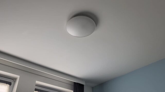 install a round ceiling lamp in a simple home setting
