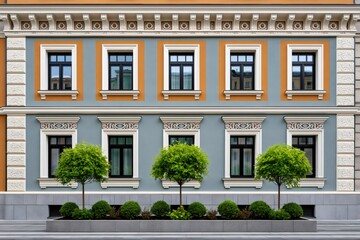 Fototapeta premium Building facade with decorative architectural elements and green trees