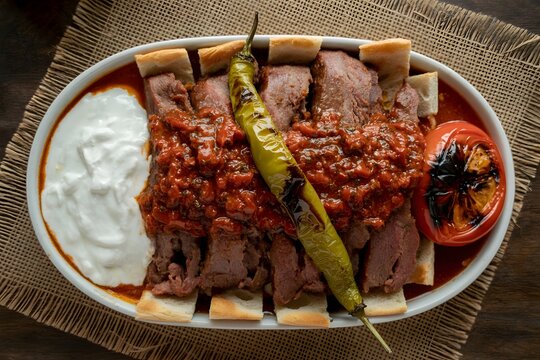 Turkish iskender kebab with yogurt and grilled pepper turkish food pita bread tomato sauce