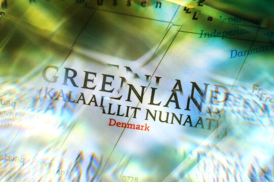 Map of Greenland seen through faceted crystal glass