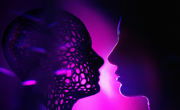 Human profile facing an artificial intelligence avatar in neon