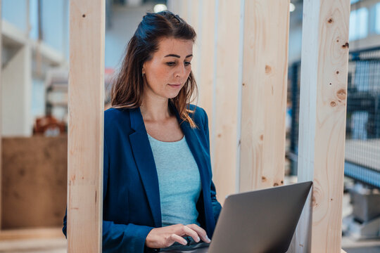 Architect using laptop working in industry
