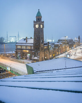 Snow covered clock tower at St Pauli Landungsbrucken in Hamburg