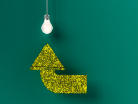 Green arrow pointing up to a glowing lightbulb symbolizing an idea