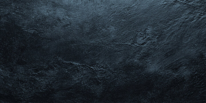 Dark wall texture background with rough stone surface and blue undertones for design and decoration