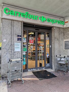 Ostia, Rome, Italy - April 26, 2026, entrance to a Carrefour Express, the name given to the neighborhood supermarket.