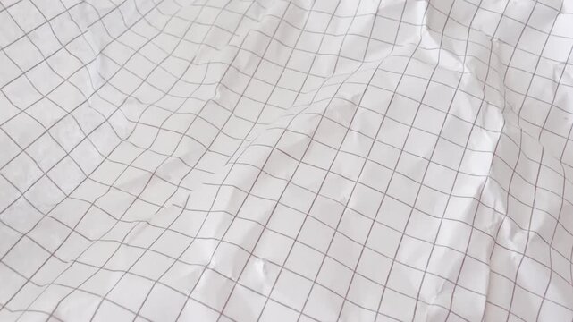 Crumpled paper texture with rough wrinkled surface creates authentic background for creative projects and artistic paper designs.