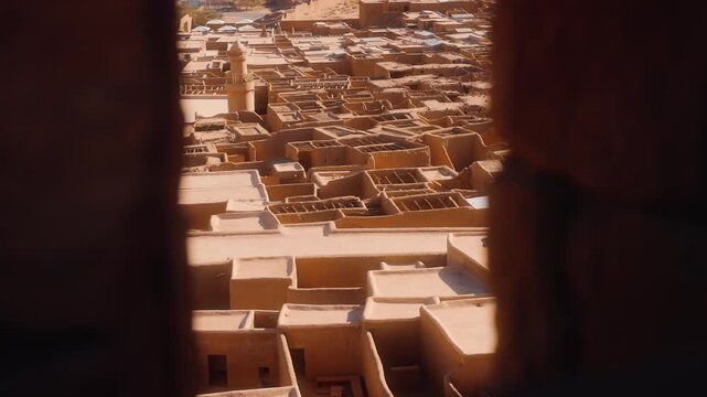 Adobe houses in Old town of AlUla, traditional Arabic village, view from the city wall on the roofs.