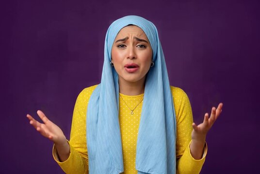 Young Muslim Woman Expressing Deep Sadness and Stress Indoors