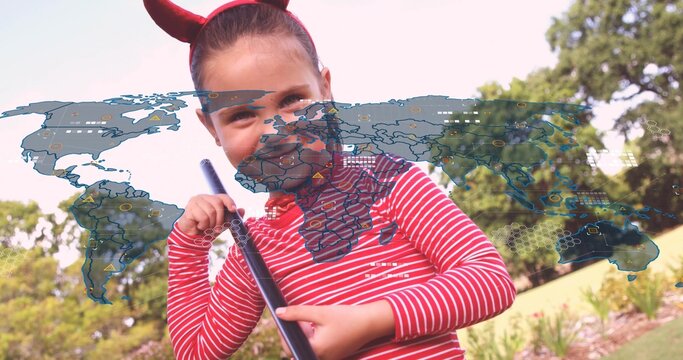 Holding black stick, girl in striped-shirt and horn-headband facing camera at park, holographic-map