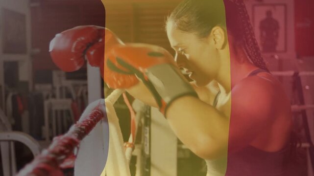 Boxer reaching red gloves putting on tapping ropes readying to box overlay moving frame tightening