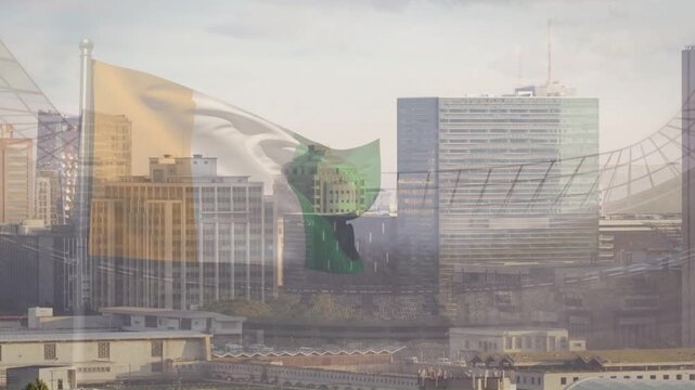 Wind gusts causing tricolor flag rippling, swinging, curling, revealing skyline through sheer bands