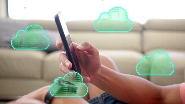 Reclining man tapping phone on sofa, teal cloud appearing and initiating cloud syncing animation