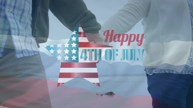 Senior duo holding hands walking shore, 'Happy 4th of July' star fading in, hiding hands, marketing