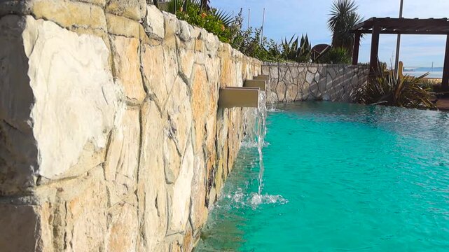 Luxury Hotel Infinity Pool Waterfall by the Ocean in Portugal
