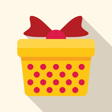 Yellow gift box featuring red polka dots and a red bow, creating a festive holiday celebration symbol