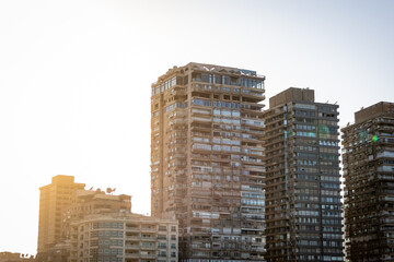 Modern high-rise residential apartment buildings at golden hour © Dewald
