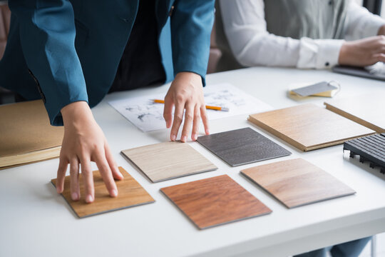 Interior designers brainstorming creative design ideas for modern home in collaborative meetingใ
