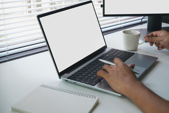 Remote work multitasking with laptop and coffee in modern workspace, hands switching between typing and holding cup, productivity lifestyle and business workflow concept